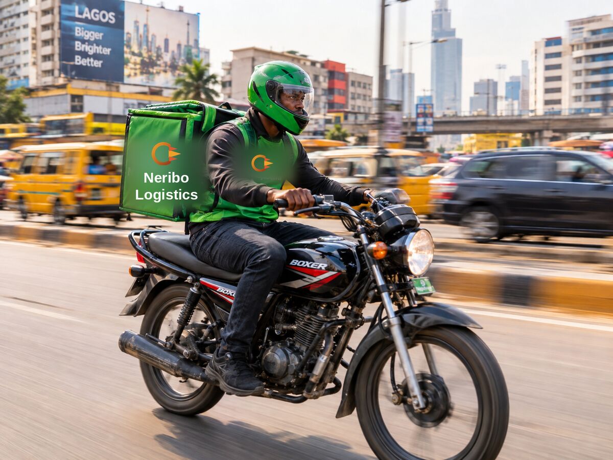 A Nigerian delivery rider in motion in an urban setting
